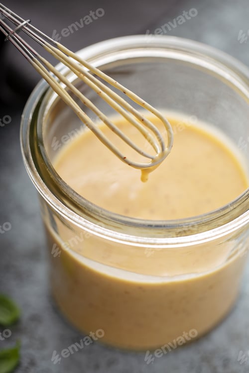Preview: Homemade honey mustard dressing in a glass jar