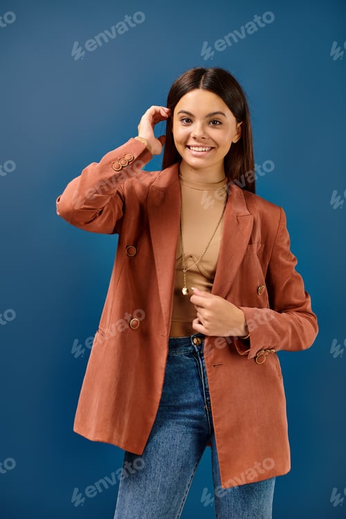 Preview: cheerful elegant teenage girl in fashionable brown blazer posing and smiling happily at camera
