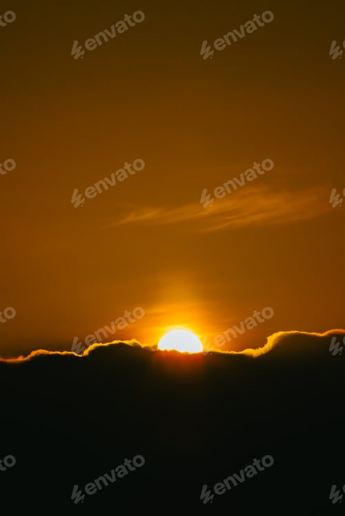 Preview: Super sunset over the black clouds wallpaper on moody tones with copy space and orange tones