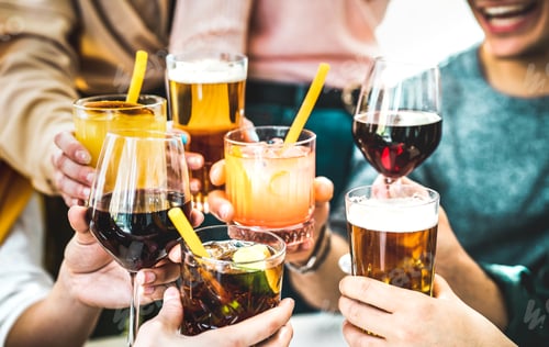 Preview: Friends hands toasting fancy cocktails