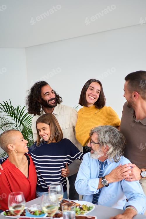 Preview: Portrait of smiling Caucasian people looking affectionately at each other embraced together at home.