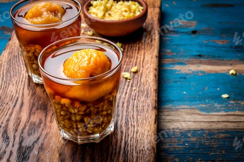 Preview: Mote con huesillo. Traditional Chilean drink made from cooked husked wheat and dried peach