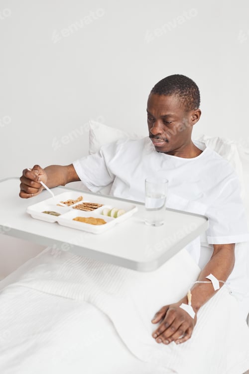 Preview: Young African American Man Eating in Hospital