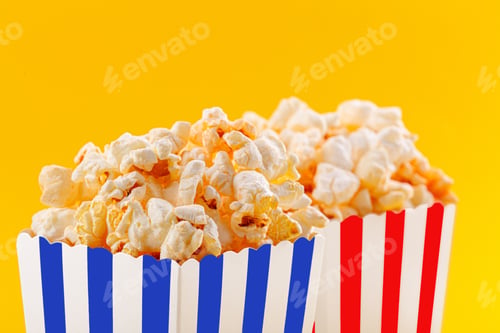 Preview: Glass with popcorn on a yellow background