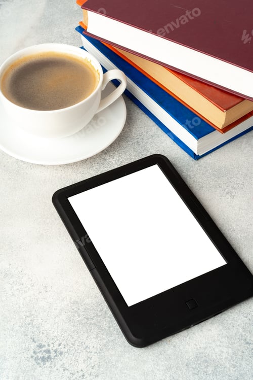 Preview: Composition with modern e-book reader, hardcover book and cup of coffee on table