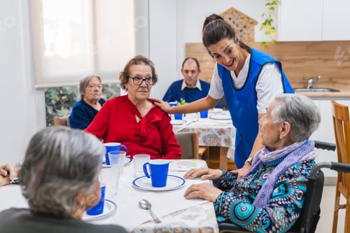 Preview: Caring nurse assisting seniors in nursing home