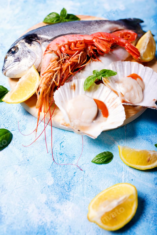 Preview: Food background with sea fish on blue.