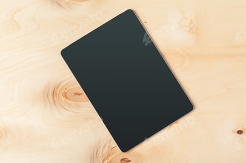 Preview: digital tablet on wooden table. creative photo