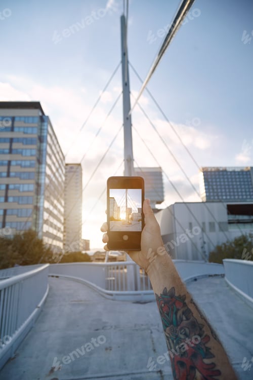 Preview: Taking a photo of city architecture at sunset