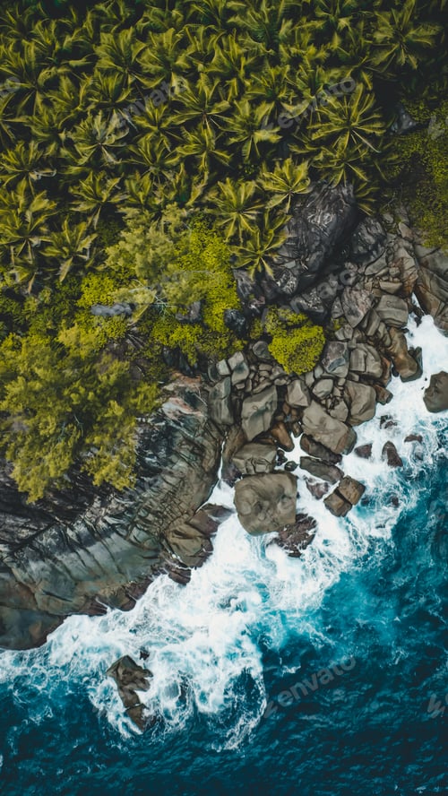 Preview: Granite stones landmark of Seychelles Islands near Indian Ocean by drone. Big waves and tropical.