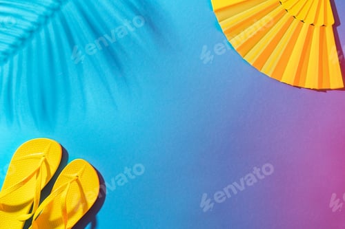 Preview: Yellow Beach Flip-Flops and Folding Fan on The Blue Background