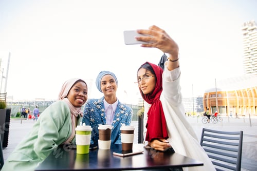 Preview: Beautiful muslim girl wearing hijab bonding outdoors