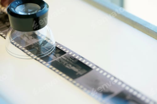 Preview: Strip of black and white negative film on lightbox