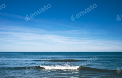 Preview: Tranquil seascape with calm sea and blue sky