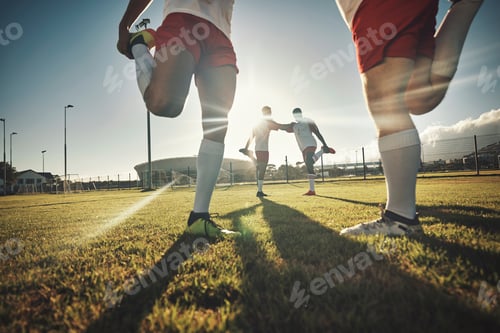 Preview: Soccer, team and stretching together on sport field for exercise, wellness and workout practice for