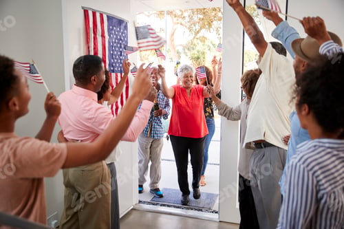 Preview: Arriving guests are welcomed at a three generation black family Independence Day house party