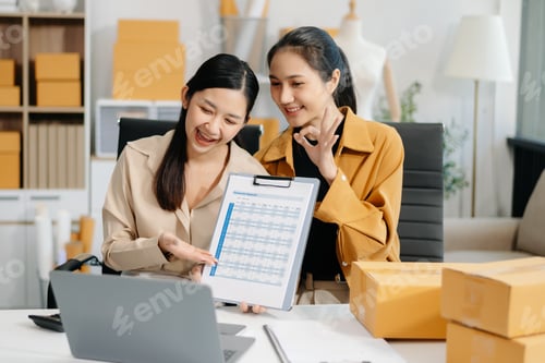 Preview: Starting small businesses SME owners, two check online orders Selling products working with boxs