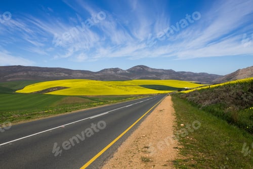 Preview: Scenic South African landscape with a road leading to Cape Town under a clear sky
