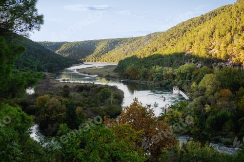 Preview: Tourist boat navigating the picturesque Krka river in Croatia's national park