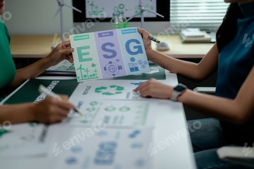 Preview: Professionals analyzing ESG concepts with charts and documents