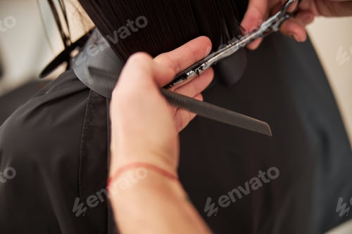 Preview: Client having her split hair ends cut with scissors