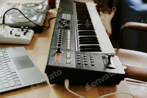 Preview: Electronic Music Keyboard and Dj Controller on Desk in Home Studio Setting