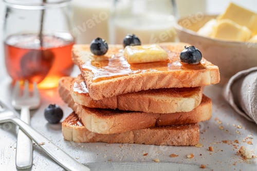 Preview: Golden French Toast with butter and honey.