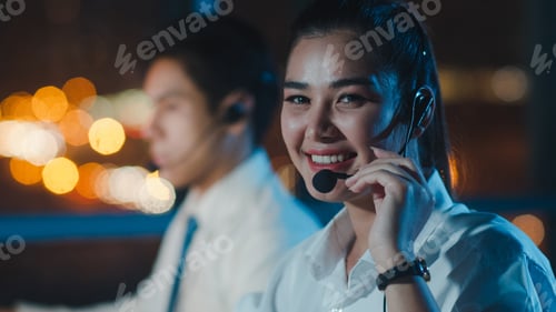Preview: Asia young call center team or customer support service executive using computer.
