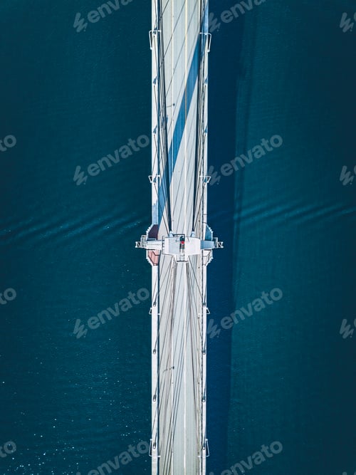 Preview: Aerial view of suspension bridge road over blue lake or sea in Finland