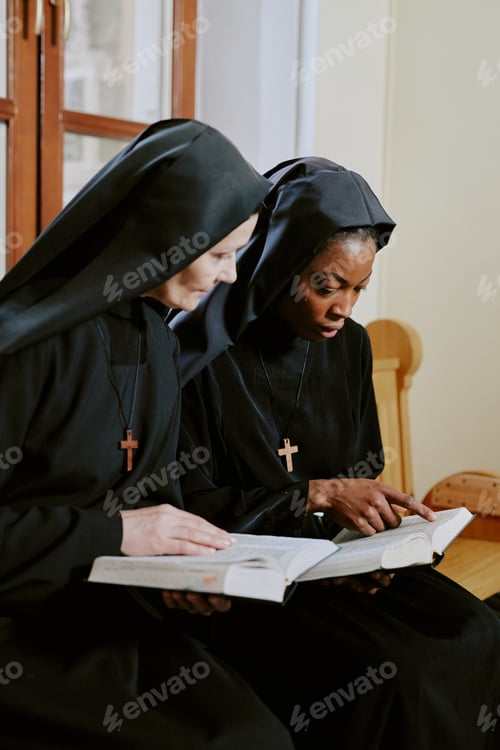 Preview: Two Nuns Discussing Text In Bible