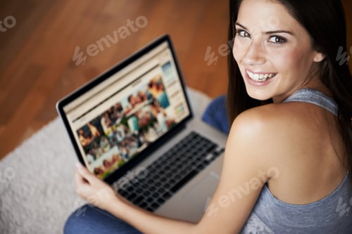 Preview: At home and at leisure. Portrait of a young woman working on a laptop at home.