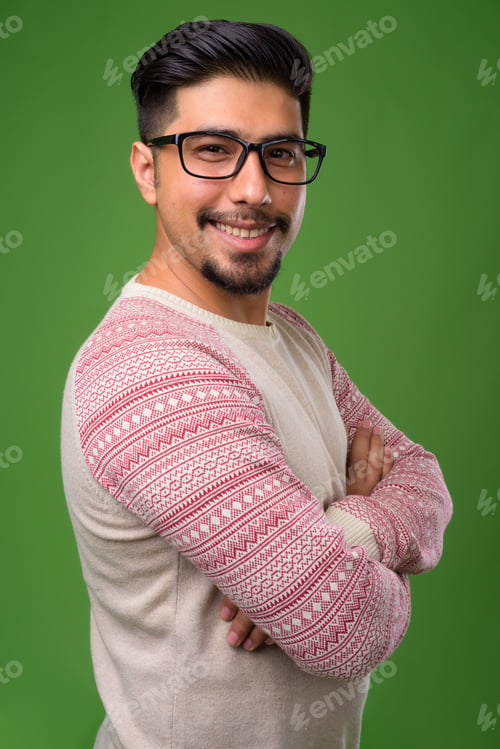 Preview: Young bearded Iranian man against green background