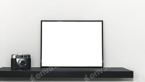 Preview: White board with space for text and a photo camera on a shelf