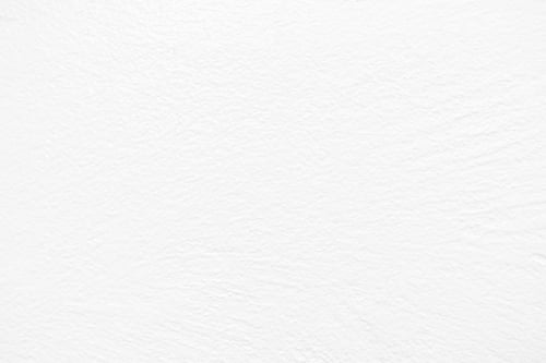 Preview: White uneven render stucco painted concrete wall texture background.