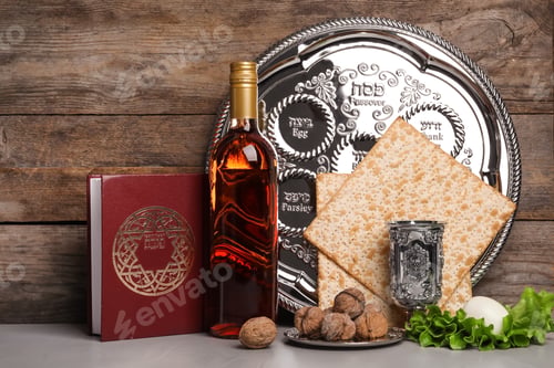 Preview: Symbolic Passover (Pesach) items on table against wooden background