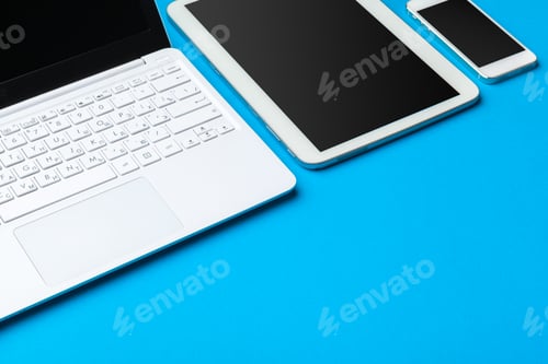 Preview: Open laptop with digital tablet on the table