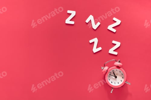Preview: Pink alarm clock rings on pink pastel background.Spring,Summertime, holiday. Minimalism. Copy space.