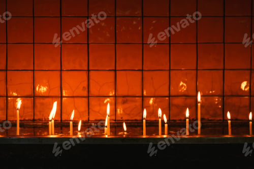 Preview: Burning candles in a straight line in church