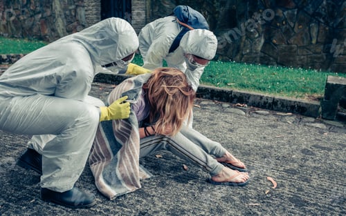 Preview: Doctors in protection suits caring for a woman