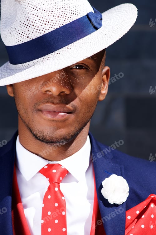 Preview: handsome young african businessman in hat