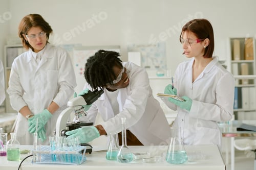 Preview: Examining Samples with Microscope in Scientific Laboratory