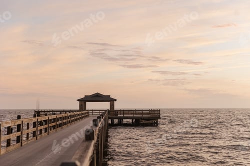 Preview: Sunset view of a dock over water in Fairhope, Alabama