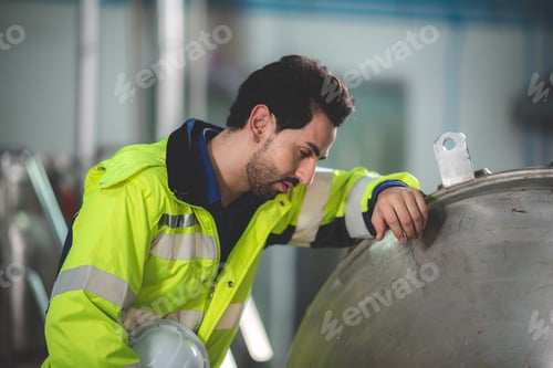 Preview: engineering worker manage working for control a production at industrial manufacturing plant