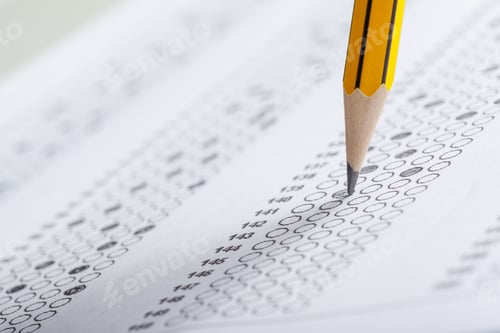 Preview: Pencil marking answers on a multiple choice test in a classroom setting during the day