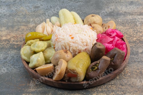 Preview: Salty vegetables in wooden bowl on marble background