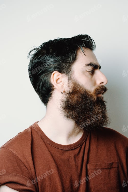 Preview: Portrait of a handsome bearded man, hipster style, serious, colorful, beauty and style