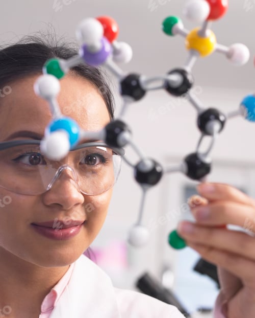 Preview: Scientist using molecular model to understand chemical formula