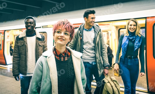 Preview: Multiracial hipster friends group walking at tube subway station