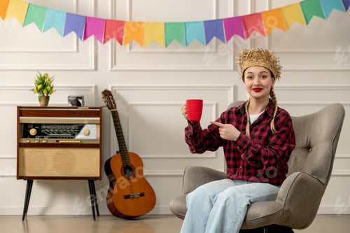 Preview: festa junina cute girl in straw hat brazilian midsummer with retro radio guitar pointing at red cup