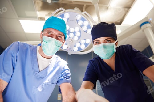 Preview: Portrait of two surgeons over the operating table
